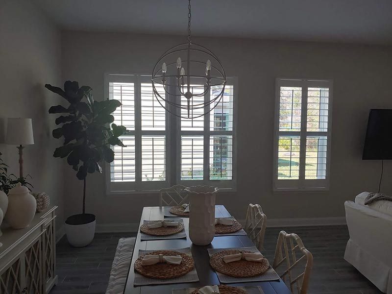 Shutters running the full wall of a dining room