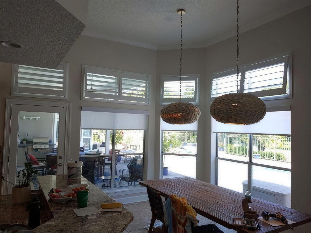 Family room with shutters managing bright afternoon light