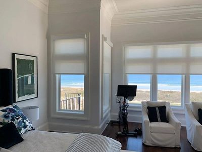 Roller shades in an oceanfront Jacksonville bedroom