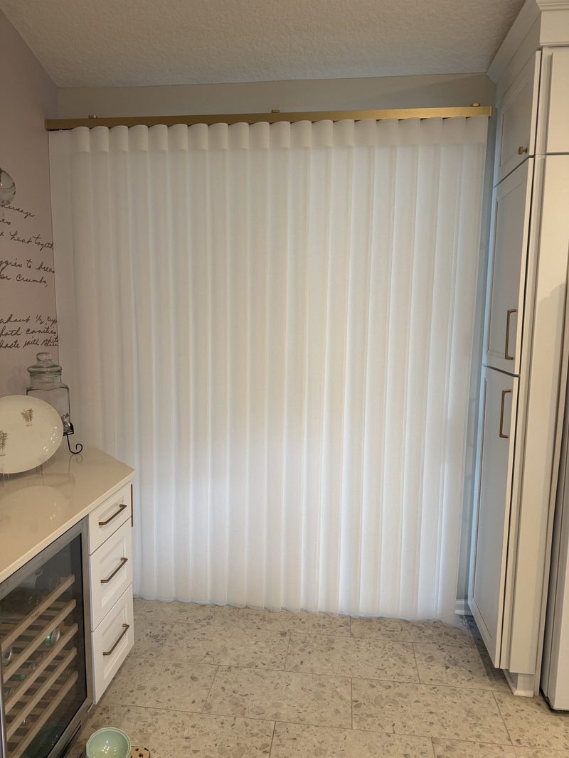 Sheer vertical blinds on a patio slider