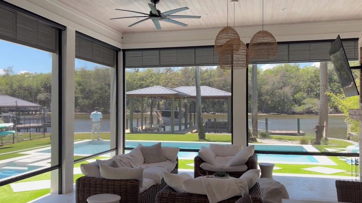 Covered patio protected by an exterior zipper track shade
