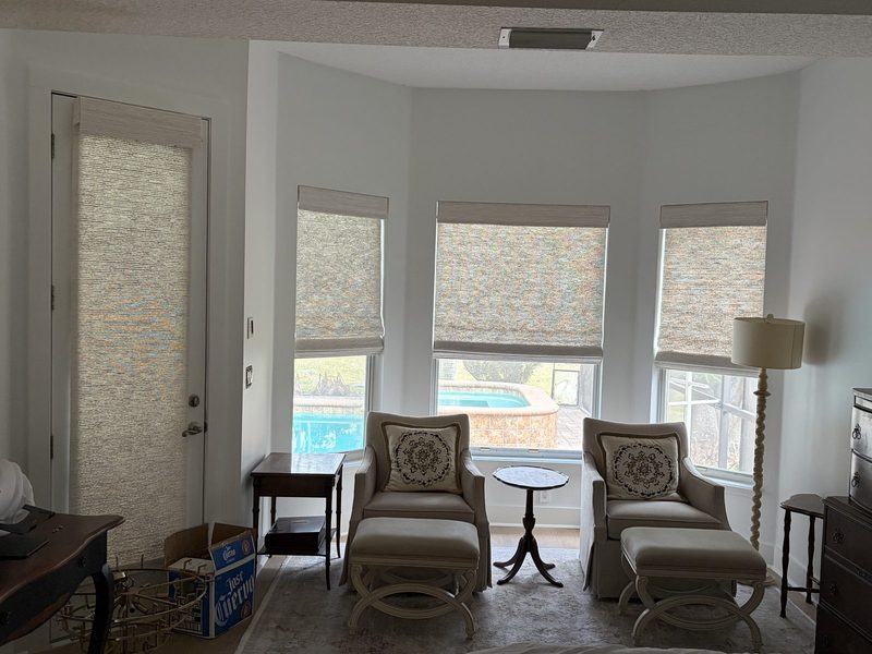 Shades in a bay window seating area