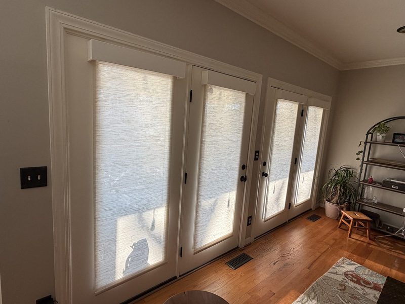 Shades fitted to a wall of French doors