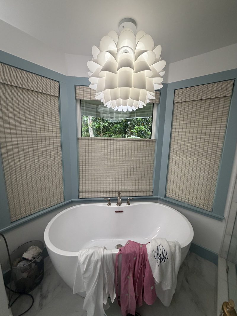 Woven shades around a freestanding tub