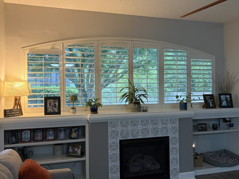 Plantation shutters with arched transom windows